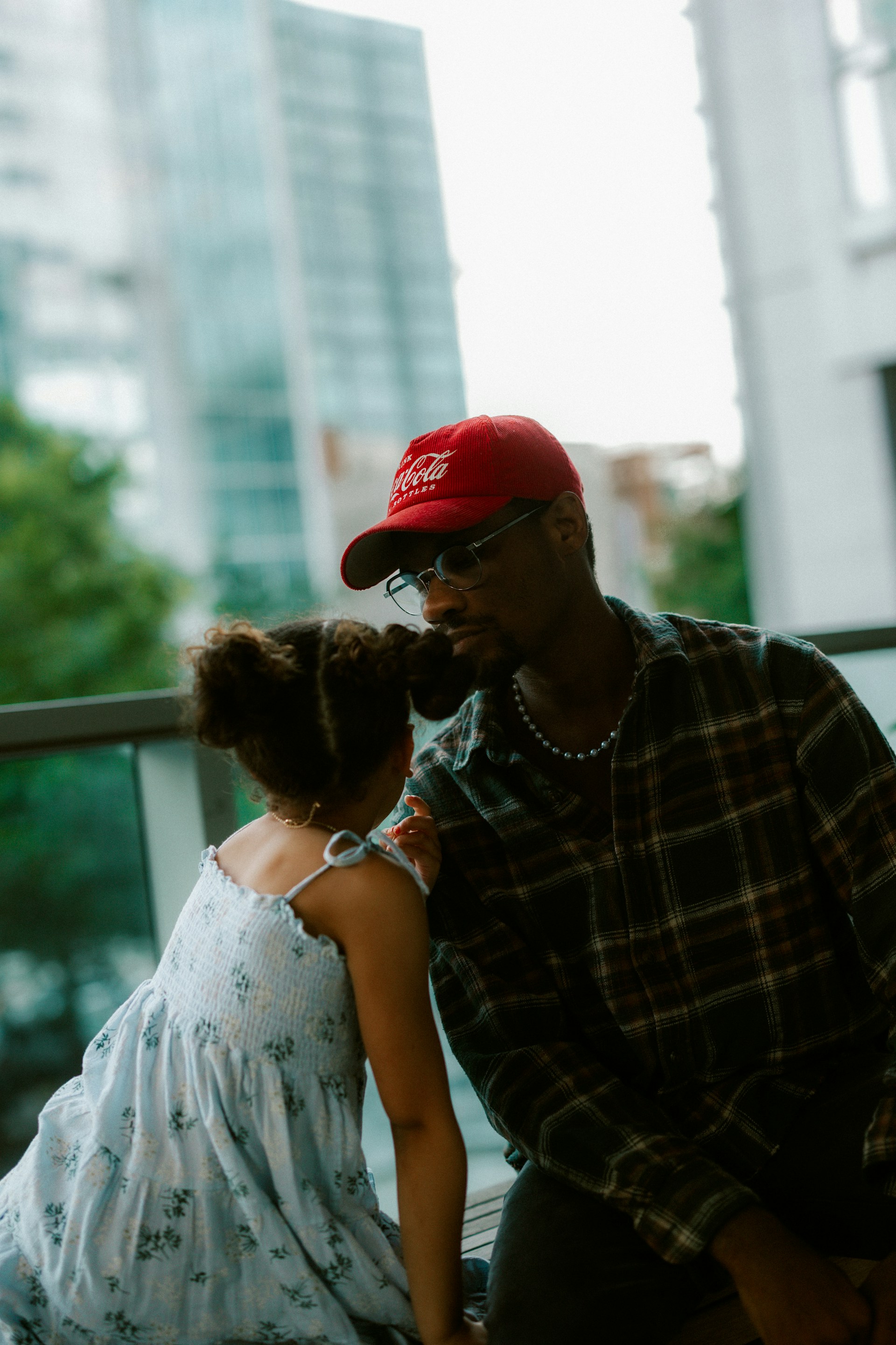 A father and daughter sharing a tender moment together.